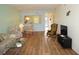 Open concept living and dining area with hardwood floors at 175 Kings Hwy # 923, Punta Gorda, FL 33983