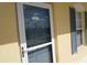 Condo front door with storm door and shutters at 175 Kings Hwy # 923, Punta Gorda, FL 33983