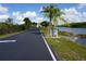 Asphalt driveway leading to St. James Place community at 175 Kings Hwy # 923, Punta Gorda, FL 33983