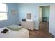 Bedroom with a wicker dresser and access to a private balcony at 175 Kings Hwy # 923, Punta Gorda, FL 33983