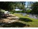 Tranquil waterfront view with a bench and lush greenery at 175 Kings Hwy # 923, Punta Gorda, FL 33983