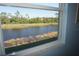 Bedroom with a picturesque view of a serene canal at 175 Kings Hwy # 923, Punta Gorda, FL 33983