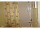 Bright bathroom with shower and tiled walls at 175 Kings Hwy # 923, Punta Gorda, FL 33983