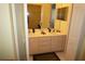 Double sink bathroom vanity with light wood cabinets at 175 Kings Hwy # 923, Punta Gorda, FL 33983