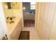 Bathroom with double vanity and view into bedroom at 175 Kings Hwy # 923, Punta Gorda, FL 33983