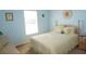 Bedroom with light-blue walls and a double bed at 175 Kings Hwy # 923, Punta Gorda, FL 33983