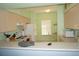 Galley kitchen with white appliances and wood cabinets at 175 Kings Hwy # 923, Punta Gorda, FL 33983
