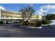 Two-story building with covered parking and landscaping at 175 Kings Hwy # 923, Punta Gorda, FL 33983