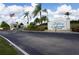Condominium entrance with signage and landscaping at 175 Kings Hwy # 923, Punta Gorda, FL 33983