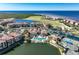 Aerial view of community with pool, tennis courts and water access at 99 Vivante Blvd # 412, Punta Gorda, FL 33950