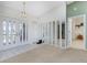 Bright foyer with a high ceiling, white tile flooring, and access to other rooms at 1759 Nuremberg Boulevard, Punta Gorda, FL 33983