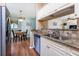 Kitchen with stainless steel dishwasher and view into the adjacent dining room at 1759 Nuremberg Boulevard, Punta Gorda, FL 33983