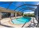 Inviting kidney-shaped pool with screened enclosure at 1759 Nuremberg Boulevard, Punta Gorda, FL 33983