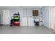 Well-lit laundry room with washer, dryer, and storage shelves at 1759 Nuremberg Boulevard, Punta Gorda, FL 33983