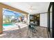 Relaxing pool area with covered patio, table and chairs, and screened enclosure at 1759 Nuremberg Boulevard, Punta Gorda, FL 33983