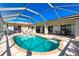 Inviting kidney-shaped pool with screened enclosure at 1759 Nuremberg Boulevard, Punta Gorda, FL 33983