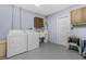 Functional laundry room with washer, dryer, cabinets, and extra space at 1759 Nuremberg Boulevard, Punta Gorda, FL 33983