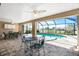Inviting pool area with screened enclosure and patio furniture at 1759 Nuremberg Boulevard, Punta Gorda, FL 33983