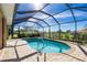 Inviting kidney-shaped pool with screened enclosure at 1759 Nuremberg Boulevard, Punta Gorda, FL 33983