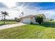 Attached garage with white door and paved driveway at 1759 Nuremberg Boulevard, Punta Gorda, FL 33983