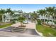 Condo building with gated entrance and lush landscaping at 5127 Melbourne St # F-204, Port Charlotte, FL 33980