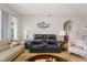 Comfortable living room with reclining sofas and coastal decor at 5127 Melbourne St # F-204, Port Charlotte, FL 33980
