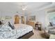 King-size bed, dresser, and seating area in the bedroom at 5127 Melbourne St # F-204, Port Charlotte, FL 33980