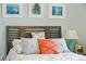Beach-themed bedroom with a wooden headboard and calming decor at 5127 Melbourne St # F-204, Port Charlotte, FL 33980
