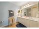 Double vanity bathroom with updated light fixtures at 5127 Melbourne St # F-204, Port Charlotte, FL 33980