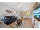 Open living room with a view into the dining and kitchen areas at 5127 Melbourne St # F-204, Port Charlotte, FL 33980