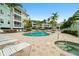 Inviting pool and spa with plenty of lounge chairs at 5127 Melbourne St # F-204, Port Charlotte, FL 33980
