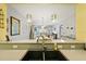 Kitchen with view into living area at 5127 Melbourne St # F-204, Port Charlotte, FL 33980
