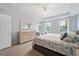 Spacious Primary bedroom with king-size bed and dresser at 5127 Melbourne St # F-204, Port Charlotte, FL 33980