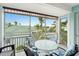 Relaxing lanai with a table and chairs, overlooking the community pool at 5127 Melbourne St # F-204, Port Charlotte, FL 33980