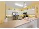 Bright kitchen features stainless steel appliances and white cabinetry at 5127 Melbourne St # F-204, Port Charlotte, FL 33980