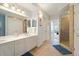 Double vanity bathroom with shower and linen closet at 5127 Melbourne St # F-204, Port Charlotte, FL 33980