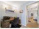 Home office with desk, chair and access to bathroom at 5127 Melbourne St # F-204, Port Charlotte, FL 33980