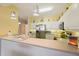 Modern kitchen with stainless steel appliances and light-colored cabinetry at 5127 Melbourne St # F-204, Port Charlotte, FL 33980