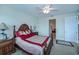 Inviting bedroom with a decorative bed frame, bedside table, and warm lighting at 25601 Heritage Lake Blvd # 46, Punta Gorda, FL 33983