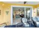 View from patio showcasing open living area, island kitchen, and beach-themed decor at 25601 Heritage Lake Blvd # 46, Punta Gorda, FL 33983