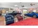 Personal cave garage with classic cars and comfy chairs at 6161 Riverside Dr, Punta Gorda, FL 33982