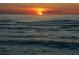 Stunning sunset over the ocean with calm waves at 3341 Rock Creek Dr, Port Charlotte, FL 33948