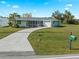 Single Gathering home with carport and yard at 3341 Rock Creek Dr, Port Charlotte, FL 33948