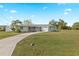 Ranch-style home with carport and yard at 3341 Rock Creek Dr, Port Charlotte, FL 33948