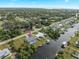 Aerial view of canal front home with private pool and dock at 3341 Rock Creek Dr, Port Charlotte, FL 33948