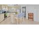 Kitchen with island, white cabinets, and stainless steel appliances at 3341 Rock Creek Dr, Port Charlotte, FL 33948