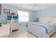 Light blue bedroom with a double bed and a dresser at 3341 Rock Creek Dr, Port Charlotte, FL 33948
