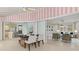 Sunroom dining area with kitchen and living room views at 3341 Rock Creek Dr, Port Charlotte, FL 33948