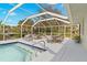 Lush patio furniture around a refreshing pool at 3341 Rock Creek Dr, Port Charlotte, FL 33948
