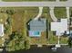 Overhead view of canal-front property with pool and dock at 3341 Rock Creek Dr, Port Charlotte, FL 33948
